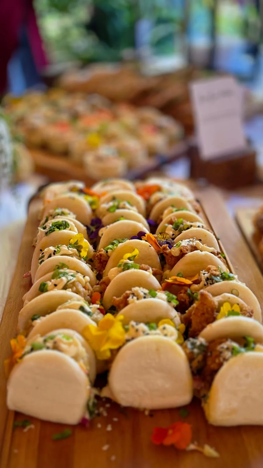 Rows of bite-sized savoury canapés on a serving board
