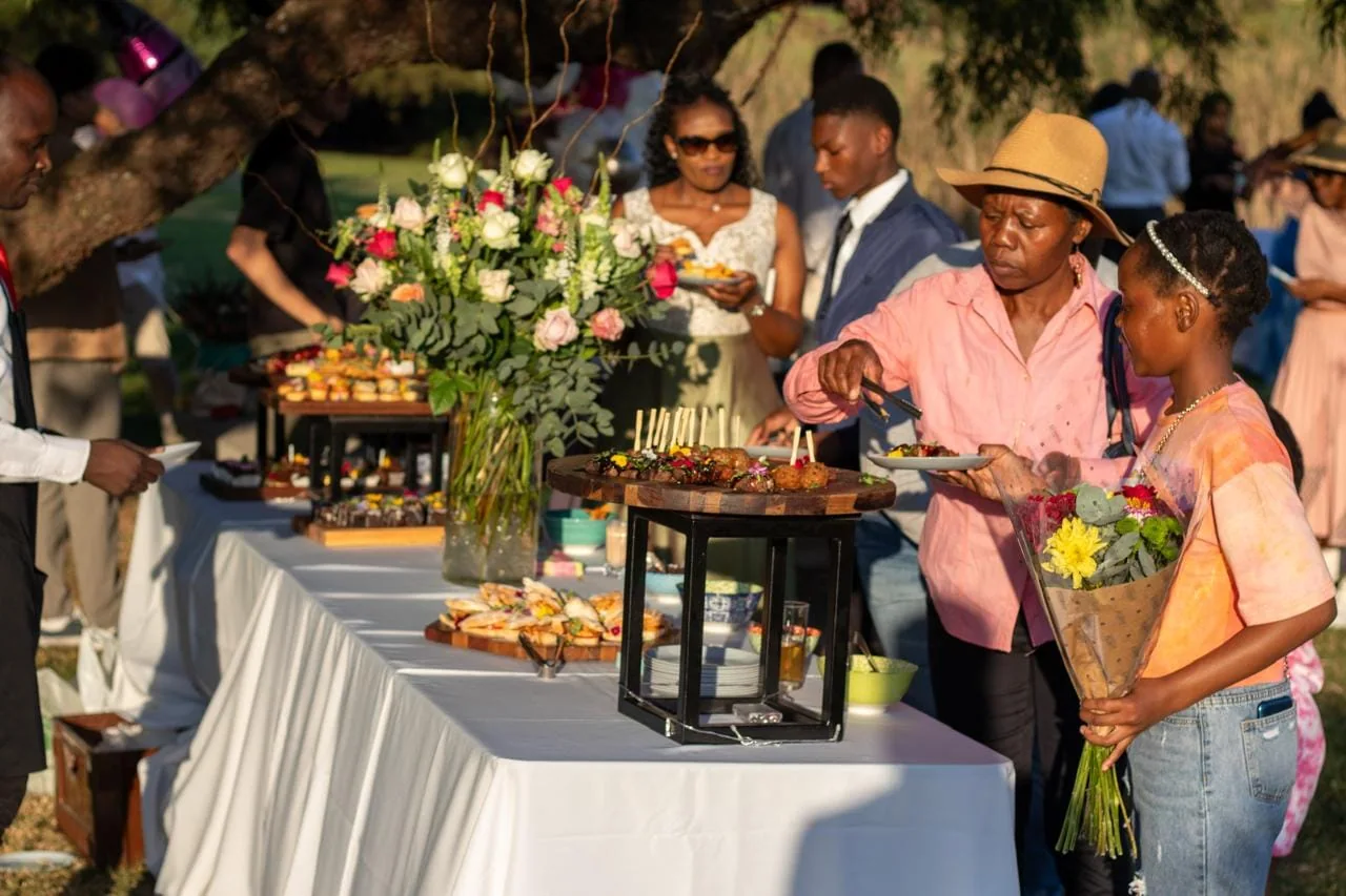 Guests enjoying a catered event food station