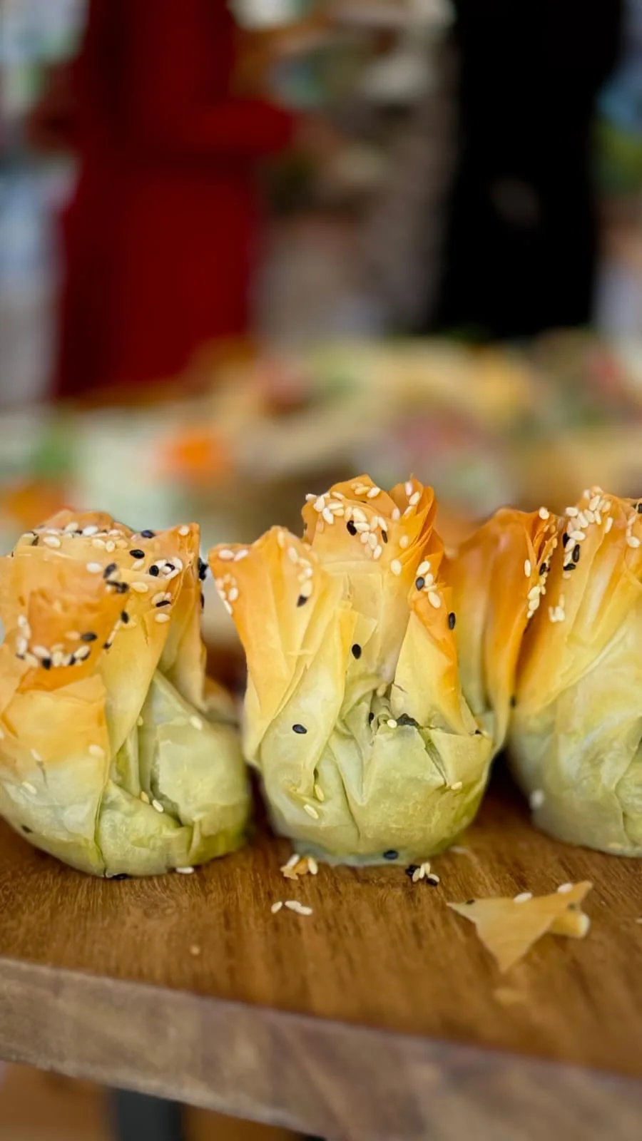 Mini pastry canapés arranged on a wooden board