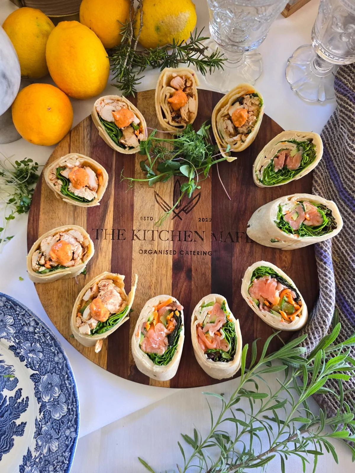 Mini wraps arranged on a wooden serving board