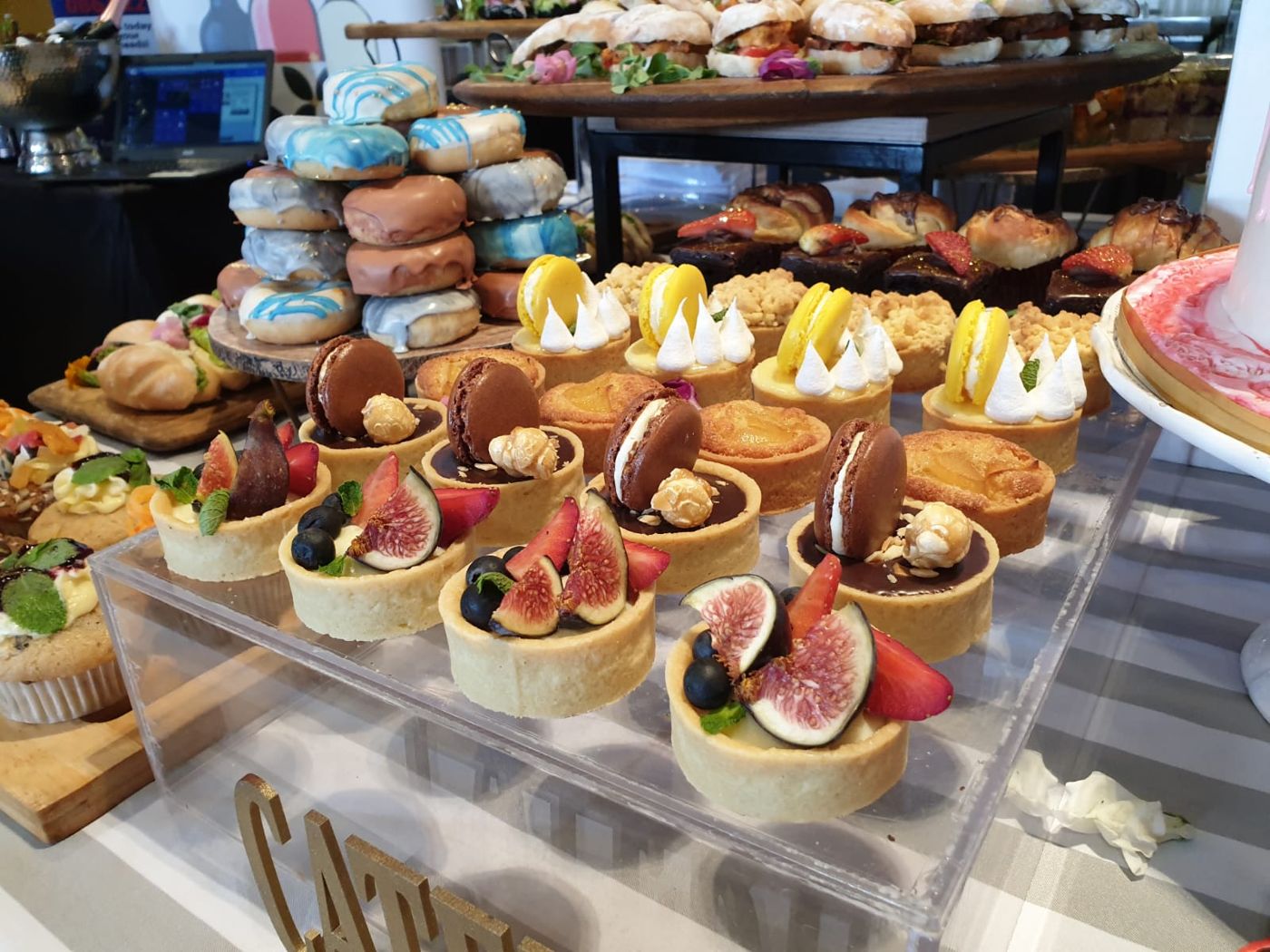 Tarts, macaroons and doughnuts on a dessert table, cakes and pastries catering Johannesburg
