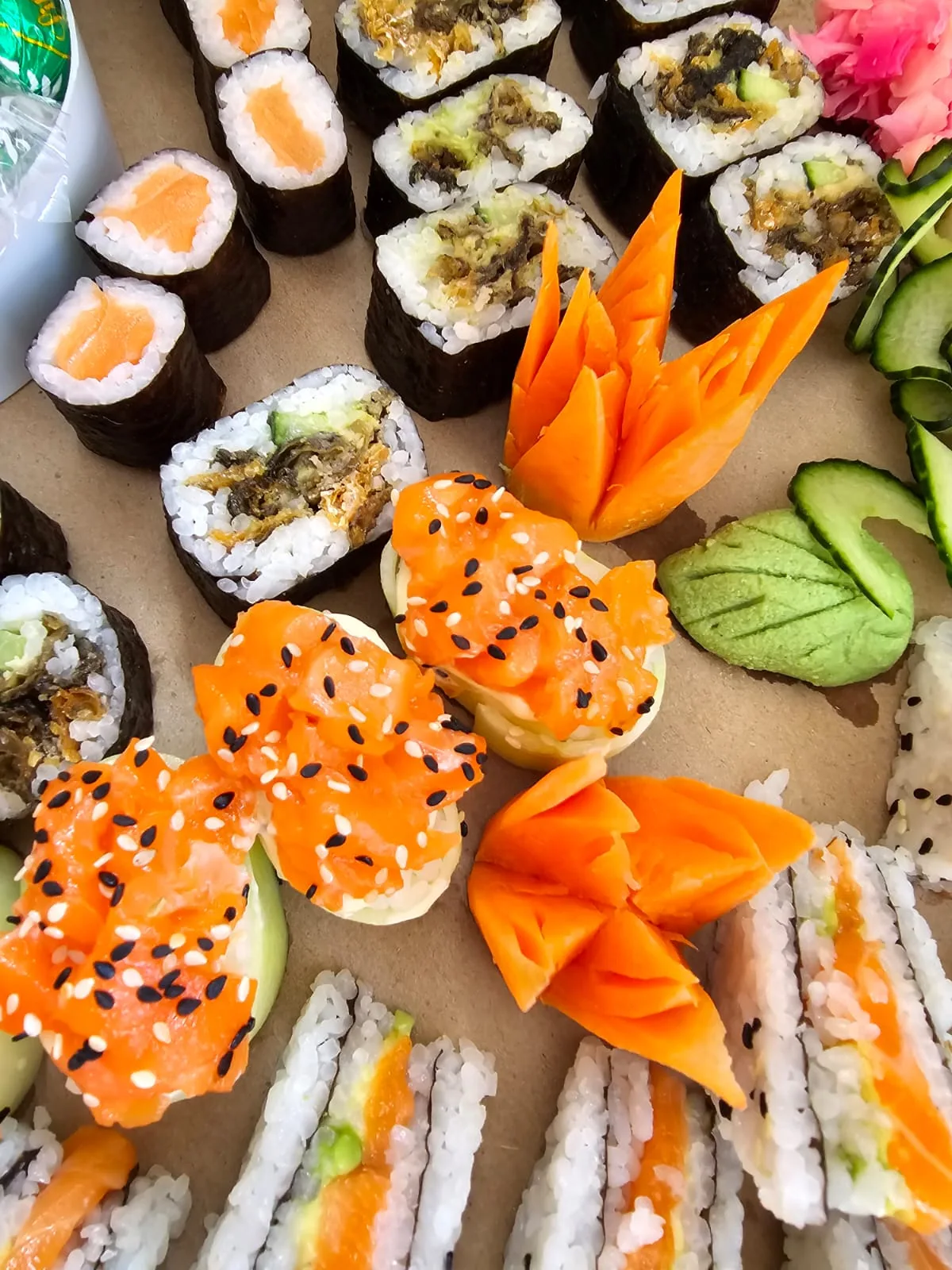 Assorted sushi and sashimi presented on a catering platter